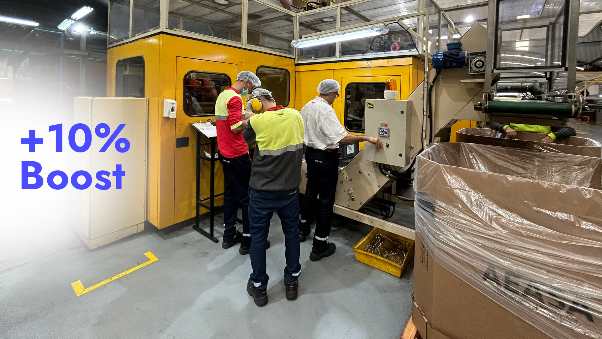 Plastic injection molding machine in operation, producing bottle preforms.